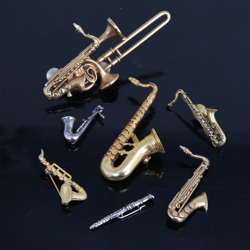 1493 - A group of good quality costume jewellery woodwind instrument brooches, including Future Primitive U... 