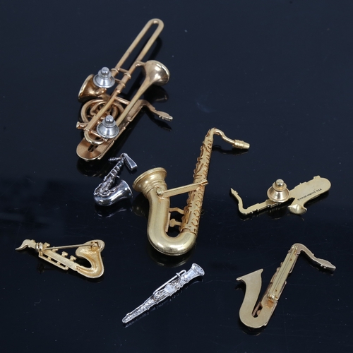 1493 - A group of good quality costume jewellery woodwind instrument brooches, including Future Primitive U... 