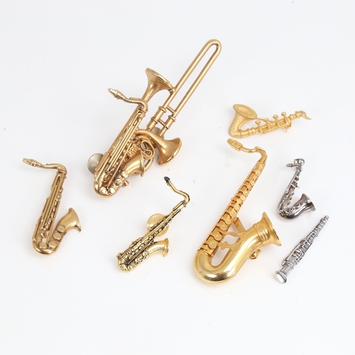 1493 - A group of good quality costume jewellery woodwind instrument brooches, including Future Primitive U... 