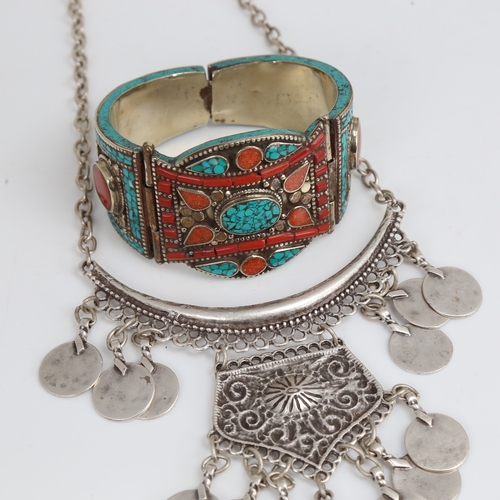 1502 - A Mexican silver-gilt stone set hinged cuff bracelet, and Treaty Aztec design necklace, length 44cm,... 