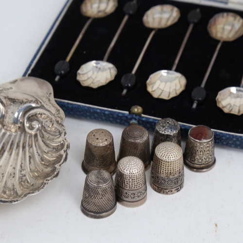 1508 - Various silver, including thimbles, shell butter dish and coffee bean spoons, 2.2oz weighable