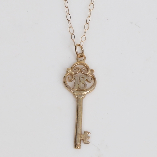 1510 - A modern 9ct gold 18th birthday key pendant necklace, on 9ct trace link chain, pendant height 28.2mm... 