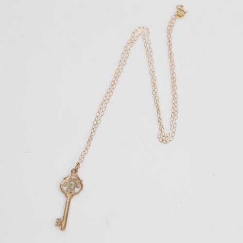 1510 - A modern 9ct gold 18th birthday key pendant necklace, on 9ct trace link chain, pendant height 28.2mm... 