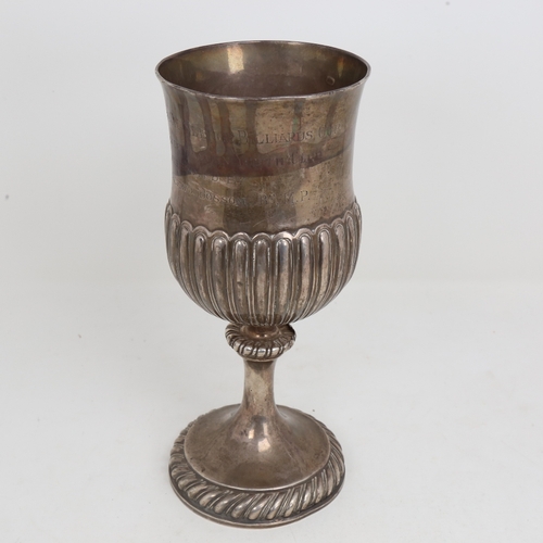 1517 - A George III Irish silver trophy cup, half fluted thistle form with gadrooned foot and presentation ... 