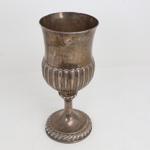 1517 - A George III Irish silver trophy cup, half fluted thistle form with gadrooned foot and presentation ... 