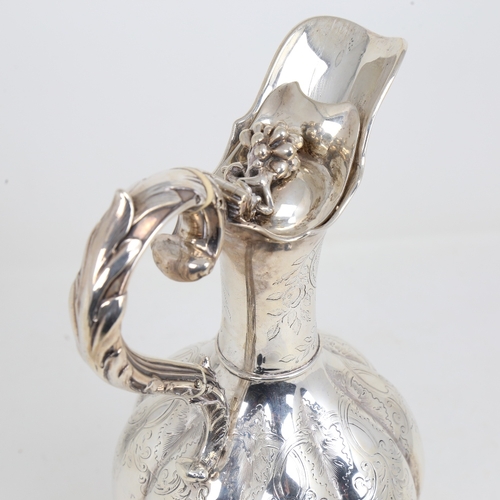 1524 - A William IV silver baluster Claret/hot water jug, lobed form with allover foliate engraved decorati... 