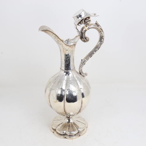 1524 - A William IV silver baluster Claret/hot water jug, lobed form with allover foliate engraved decorati... 