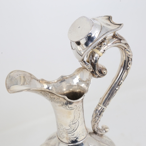 1524 - A William IV silver baluster Claret/hot water jug, lobed form with allover foliate engraved decorati... 