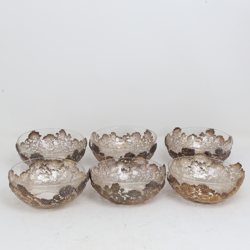 1527 - A set of 6 Chinese export silver and clear glass bowls, by Wang Hing, circular form with relief embo... 