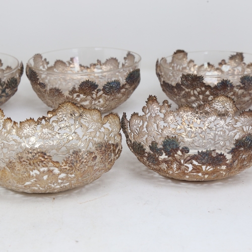 1527 - A set of 6 Chinese export silver and clear glass bowls, by Wang Hing, circular form with relief embo... 