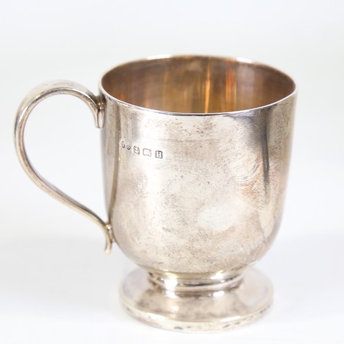 87 - A George V silver christening mug, cylindrical form with pedestal base and gilt interior, makers mar... 