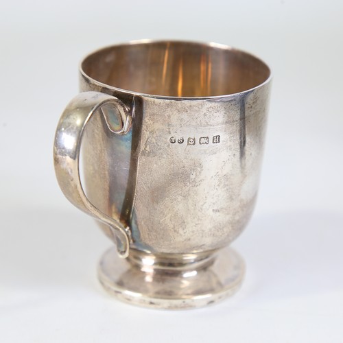 87 - A George V silver christening mug, cylindrical form with pedestal base and gilt interior, makers mar... 