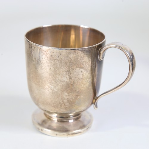 87 - A George V silver christening mug, cylindrical form with pedestal base and gilt interior, makers mar... 