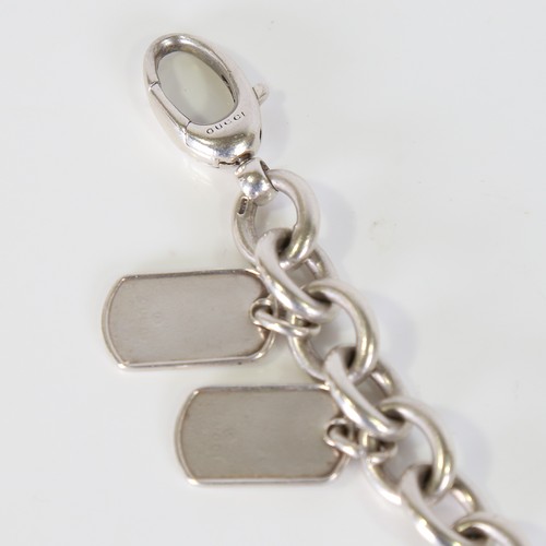 91 - GUCCI - a heavy Italian silver curb link bracelet, with 2 Dog Tag charms, bracelet length 20cm, 51.8... 