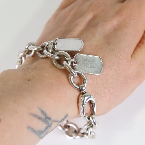 91 - GUCCI - a heavy Italian silver curb link bracelet, with 2 Dog Tag charms, bracelet length 20cm, 51.8... 