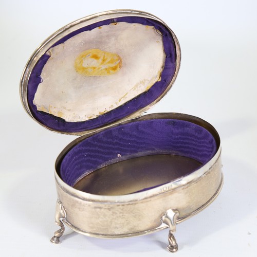 95 - An Edwardian silver dressing table jewel box, oval form on hoof feet, by Goldsmiths and Silversmiths... 