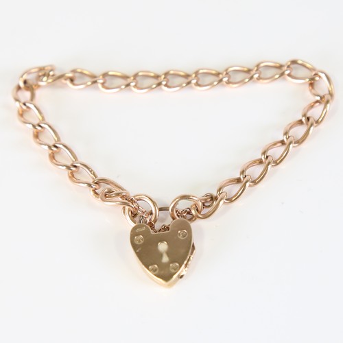 97 - A mid-20th century 15ct rose gold curb link bracelet, with 9ct heart padlock locket clasp, hallmarks... 