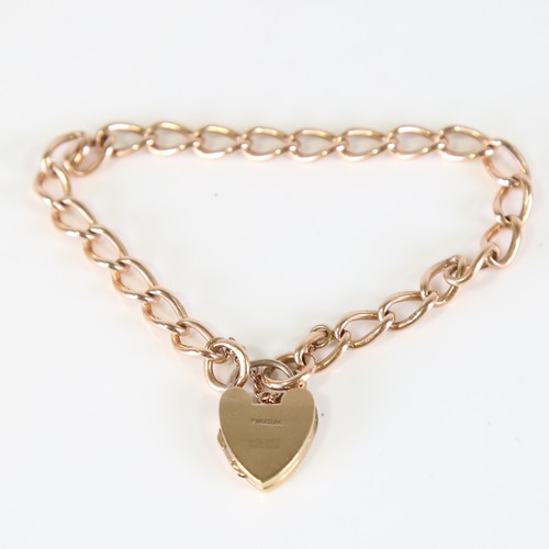 97 - A mid-20th century 15ct rose gold curb link bracelet, with 9ct heart padlock locket clasp, hallmarks... 