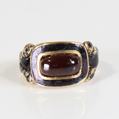 101 - A Georgian 18ct gold garnet and black enamel mourning ring, set with oval cabochon garnet with foil ... 