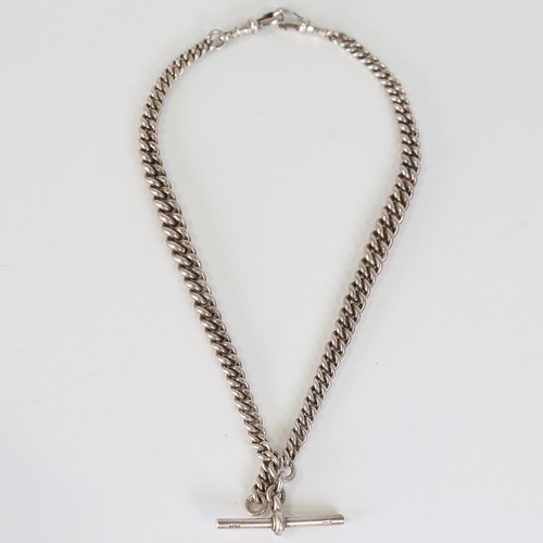 102 - An early 20th century silver graduated double Albert curb link watch chain, with 2 dog clips and T-b... 