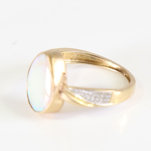 106 - A modern 9ct gold opal and diamond dress ring, set with pear cabochon opal and eight cut diamond sho... 