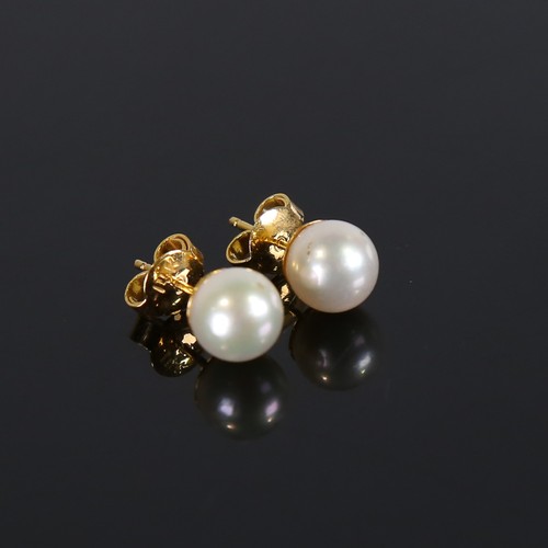 107 - A pair of handmade 14ct gold Japanese whole pearl earrings, plain settings with stud fittings, pearl... 