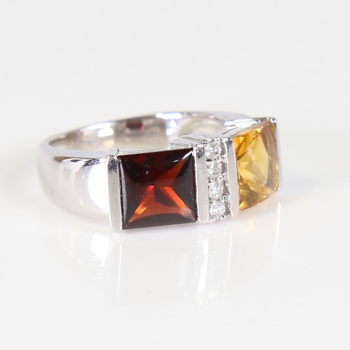 109 - A modern 18ct white gold citrine garnet and diamond dress ring, set with cabochon princess cut stone... 