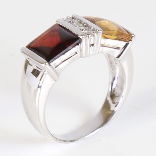 109 - A modern 18ct white gold citrine garnet and diamond dress ring, set with cabochon princess cut stone... 