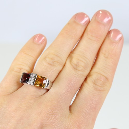 109 - A modern 18ct white gold citrine garnet and diamond dress ring, set with cabochon princess cut stone... 