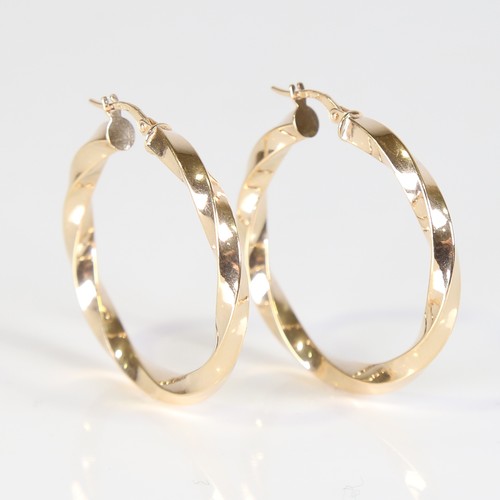 121 - A large modern pair of 9ct gold twisted hoop earrings, earring height 38.4mm, 3g