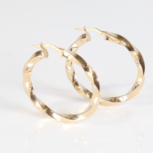 121 - A large modern pair of 9ct gold twisted hoop earrings, earring height 38.4mm, 3g