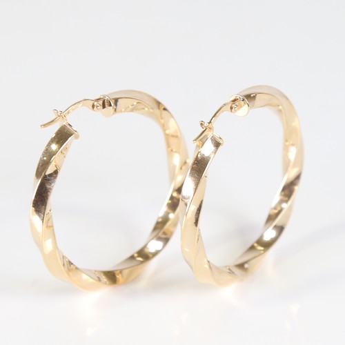 121 - A large modern pair of 9ct gold twisted hoop earrings, earring height 38.4mm, 3g