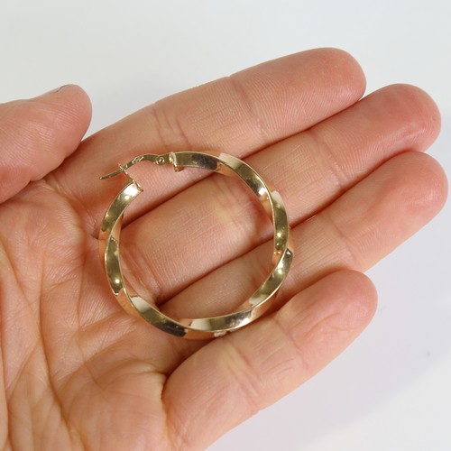 121 - A large modern pair of 9ct gold twisted hoop earrings, earring height 38.4mm, 3g