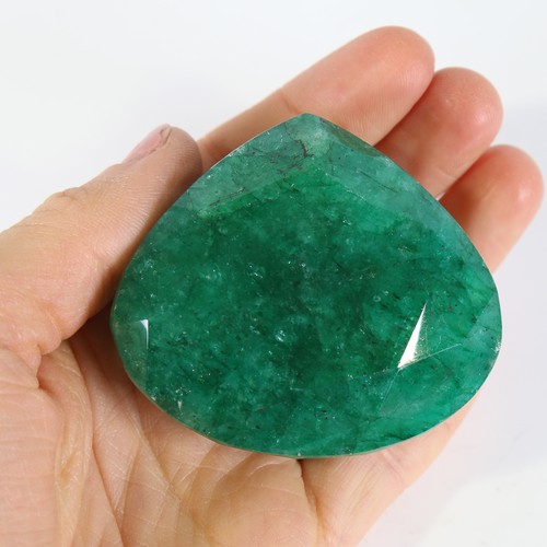 124 - 641ct unmounted pear cut emerald, dimensions: 59.00 x 53.00 x 34.00mm, 128.42g, with GLI Gemstone Re... 