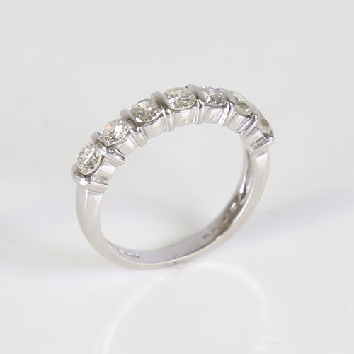 127 - An modern platinum 7-stone diamond ring, set with round brilliant cut diamonds, total diamond conten... 