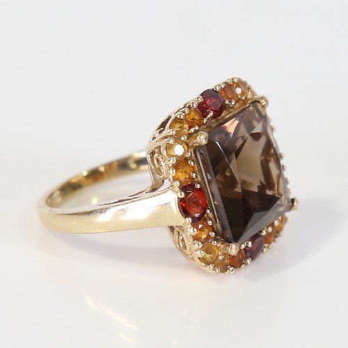 128 - A late 20th century 9ct gold gem-set ring, set with smoky quartz, garnet and citrine, setting height... 