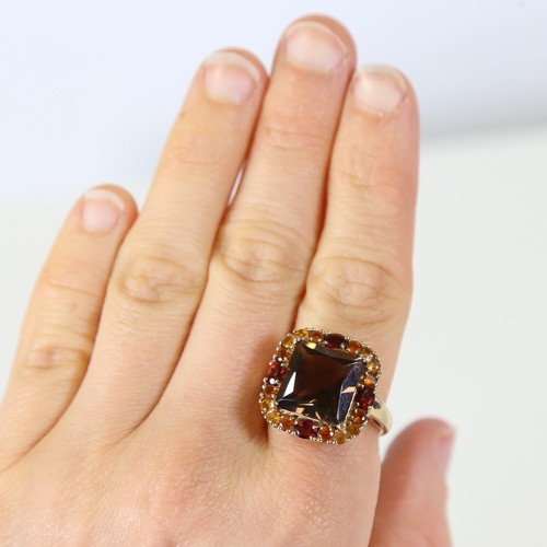 128 - A late 20th century 9ct gold gem-set ring, set with smoky quartz, garnet and citrine, setting height... 