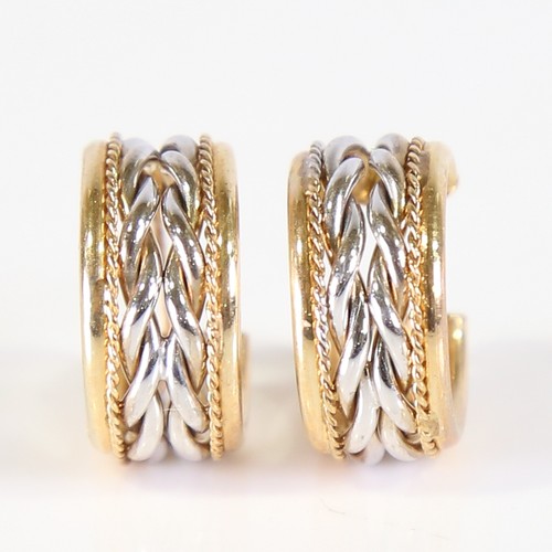 82 - A pair of modern 9ct white and yellow gold hoop earrings, ropetwist design with French lock fittings... 