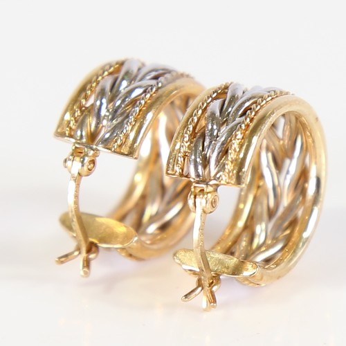 82 - A pair of modern 9ct white and yellow gold hoop earrings, ropetwist design with French lock fittings... 