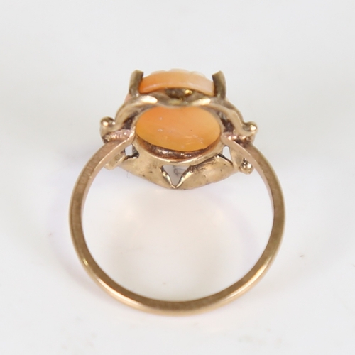 115 - A late 20th century cameo ring, unmarked gold settings with central relief carved shell depicting a ... 