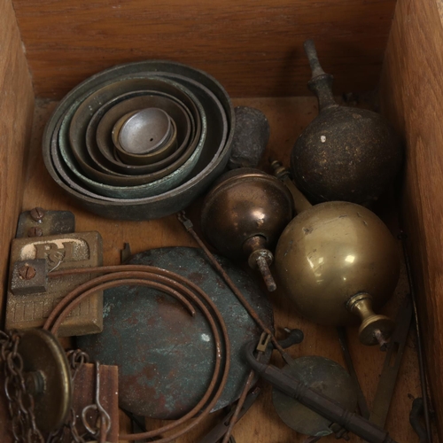 110 - Various clock parts, including pendulums, graduated bells, longcase chain and pulley etc (boxful)