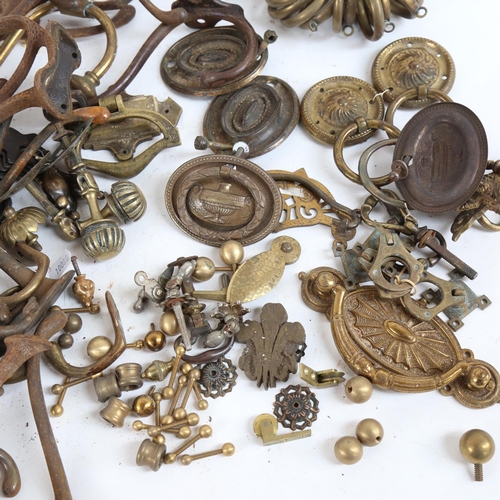 111 - Various door furniture and mounts, including cabinet handles, curtain rings, hallstand hooks etc (2 ... 