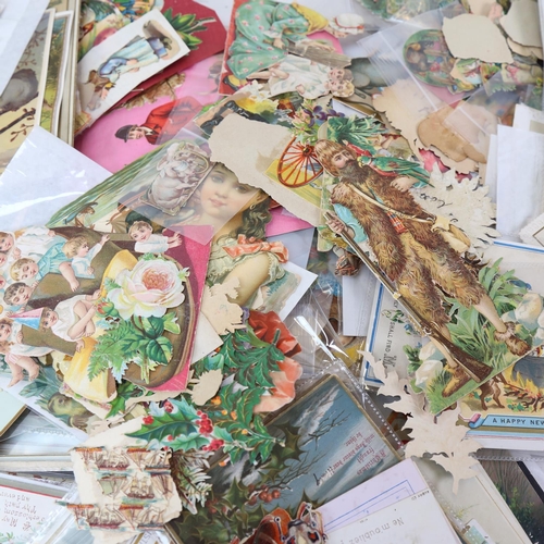 118 - A Victorian scrap album, with various cut-outs, scraps, postcards, Christmas cards etc (2 boxes)