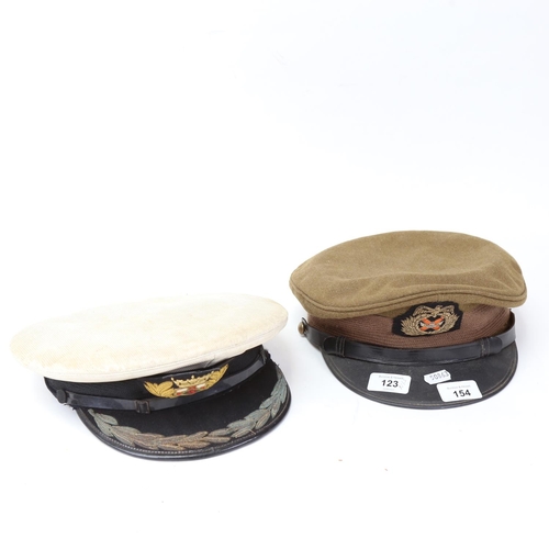 154 - 2 military caps, including 1990/91 Gulf War Kuwait Officer's cap, and Merchant Navy Captain's cap (2... 