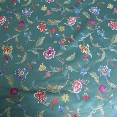 160 - A roll of green woven fabric with floral crewelwork embroidery, approx 700cm x 140cm