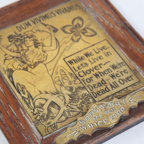 55 - An Art Nouveau brass Dum Vivimus Vivamus plaque sign, by Borsberry of Whichford, oak-framed, overall... 