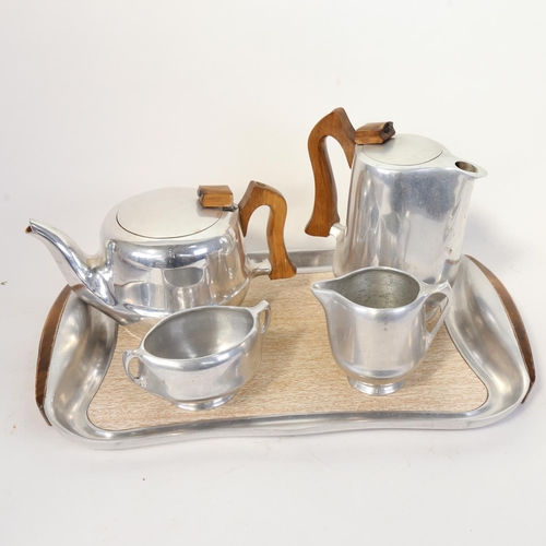 70 - A Vintage Piquot aluminium tea service, comprising teapot, water jug, sugar bowl, cream jug and tray... 