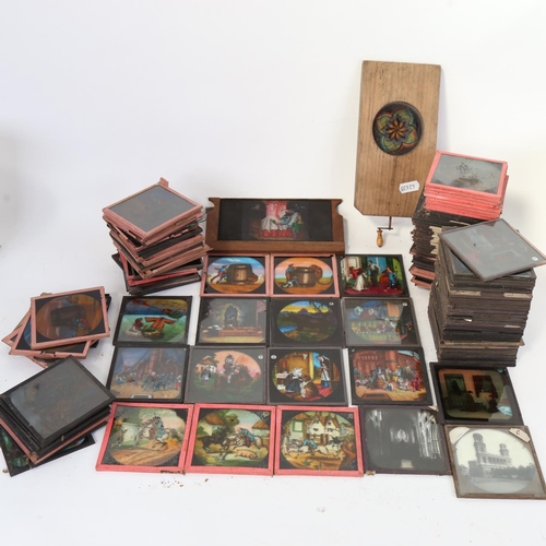 73 - A large quantity of various magic lantern slides, including moving kaleidoscope and many coloured ca... 