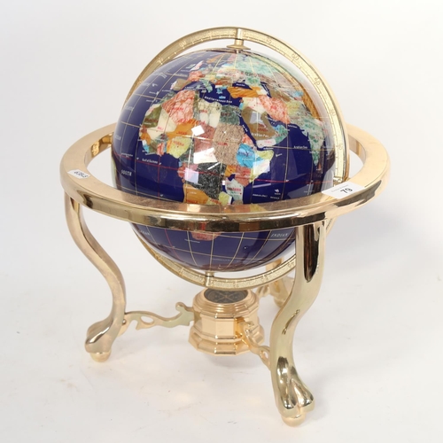 79 - A brass and hardstone table-top globe, with compass inset base, overall height 33cm, globe diameter ... 