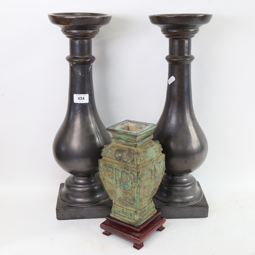 613 - A Chinese Archaic style verdigris vessel vase, and a pair of glazed ceramic candle stands, height 50... 